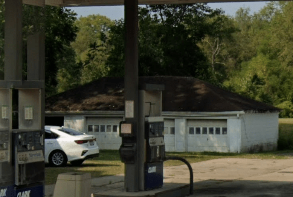 Four-bay white garage used as the recycling center behind the Amsterdam Lending Library.